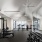 Modern fitness center at Norden Range with gym equipment, natural lighting, and vaulted ceilings.