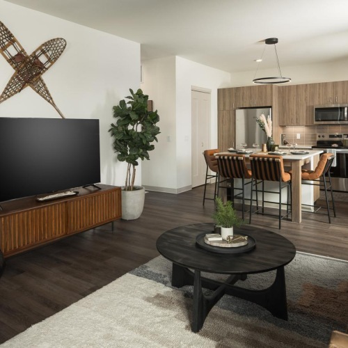 Wide open living areas perfect for entertaining a living room with a tv and couches