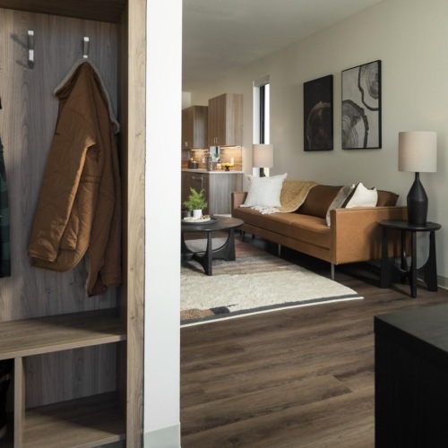 Your new home is waiting a room with a couch and a table